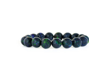 Beautiful rare Black Opal beads in bracelet on white background