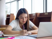 young-asian-students-in-casual-wear-do-homework-and-use-a-technology-laptop-in-the-university-library-the-students-are-searching-for-knowledge-and-are-preparing-for-the-exam-free-photo