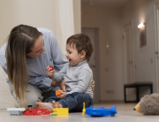 full-shot-smiley-mother-kid-playing-together